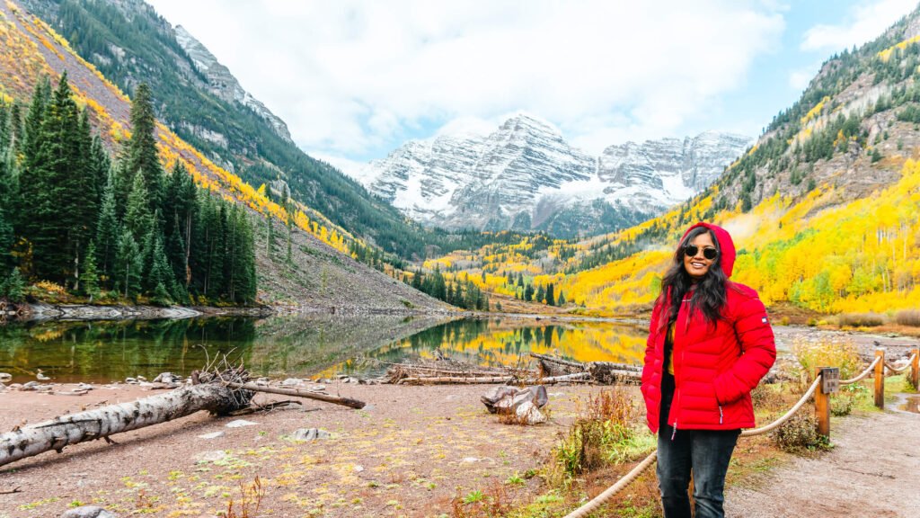 Golden aspens reflecting on Maroon Lake at Maroon Bells in autumn