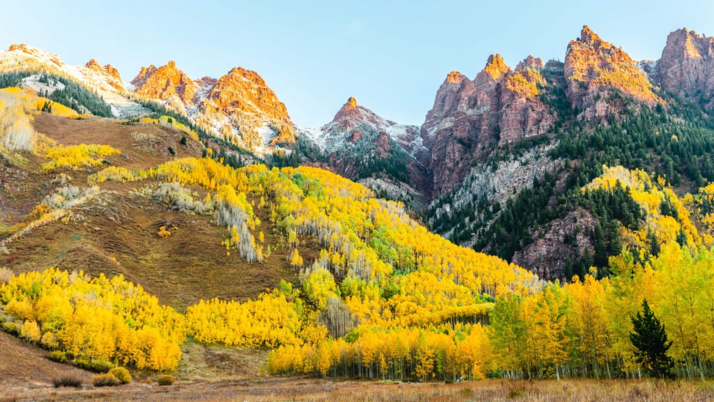 Colorado Maroon Bells with snow-capped peaks and fall foliage