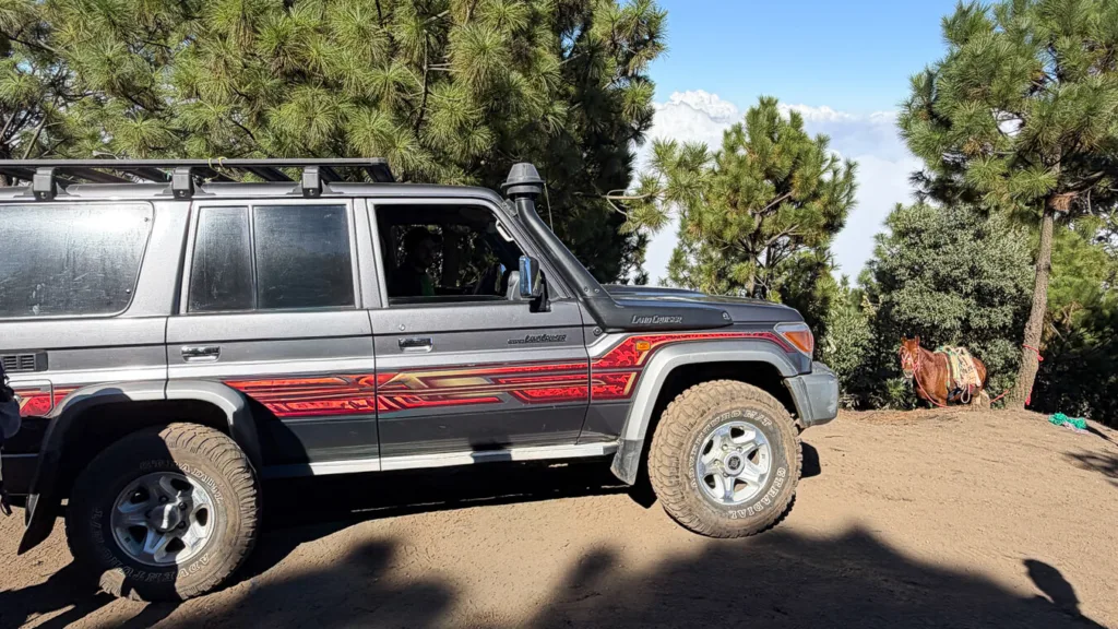 Off-road 4x4 vehicle climbing Acatenango volcano trail